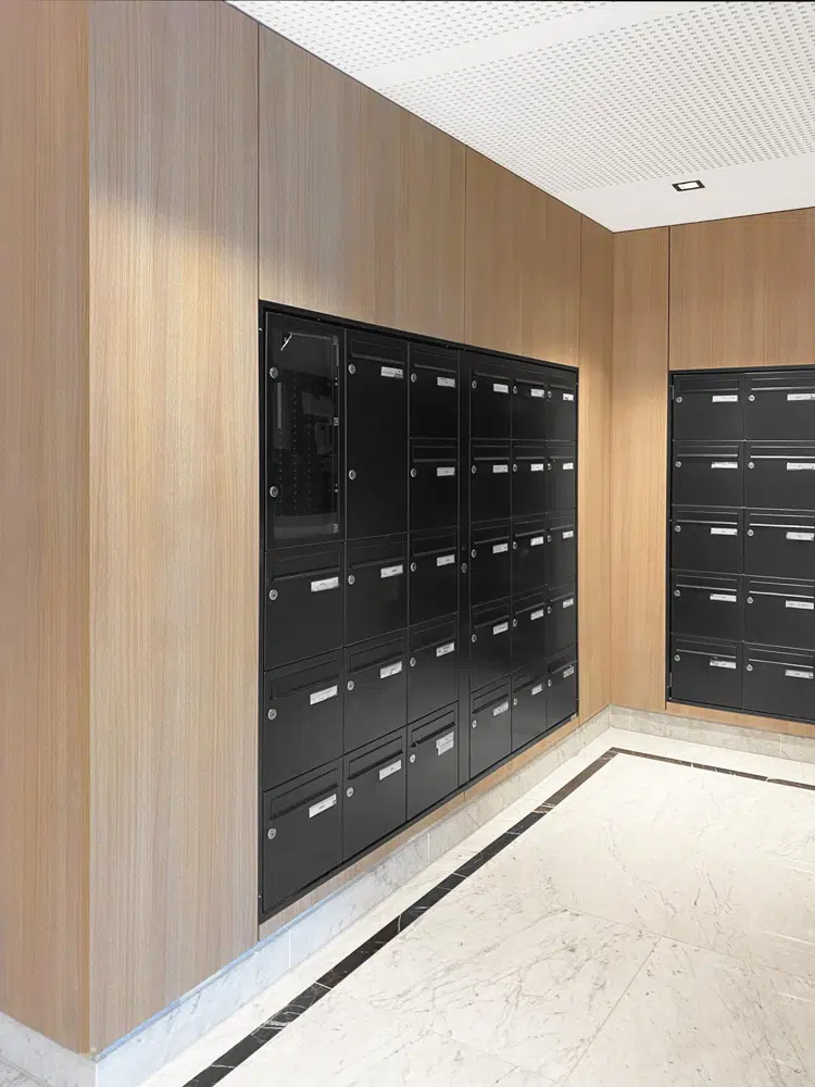 Modern black and wood entrance hall designed by Interface design for a promoter